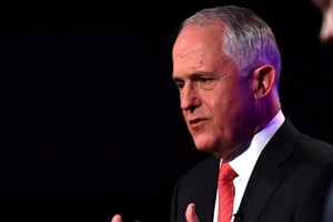 "There's no public funding in Adani's coal mine," Turnbull said. He told the protester that he took climate change "as seriously as you". (AP Photo)