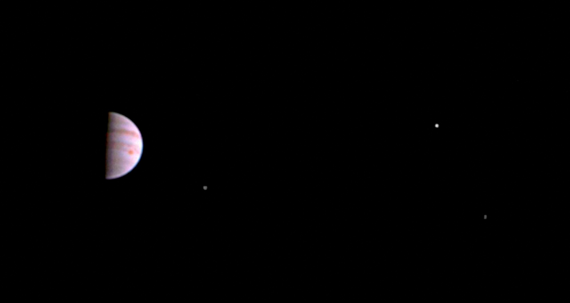 The image was taken on July 10 when the spacecraft was 4.3 million km from Jupiter on the outbound leg of its initial 53.5-day capture orbit. The colour image shows atmospheric features on Jupiter, including the famous Great Red Spot, and three of the massive planet's four largest moons -- Io, Europa and Ganymede, from left to right in the image. (Source: Twitter)
