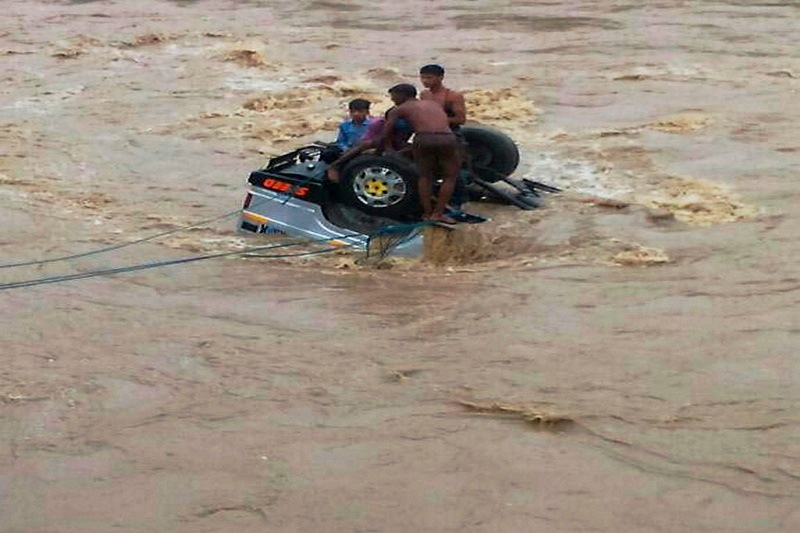 Passengers being rescued after a speedy jeep fell down in Machna river in Betul district of Madhya Pradesh on Monday. In Madhya Pradesh, where rain-related incidents claimed 22 lives till yesterday, there was as no fresh casualty reported in the last 24 hours. (PTI)