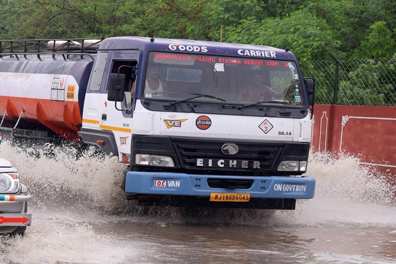 Bikaner: Vehicles move at a waterlogged road after rains in Bikaner.Incessant heavy rain in south eastern parts of Rajasthan has affected normal life. An Army team has been called to help in relief and rescue operation in the affected villages. (PTI)