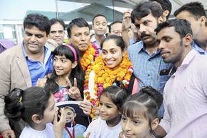 Hundreds of fans, officials, followers, admirers and well-wishers received Dipa and her coach Bisheshwar Nandi at the Agartala airport. (Source: PTI)