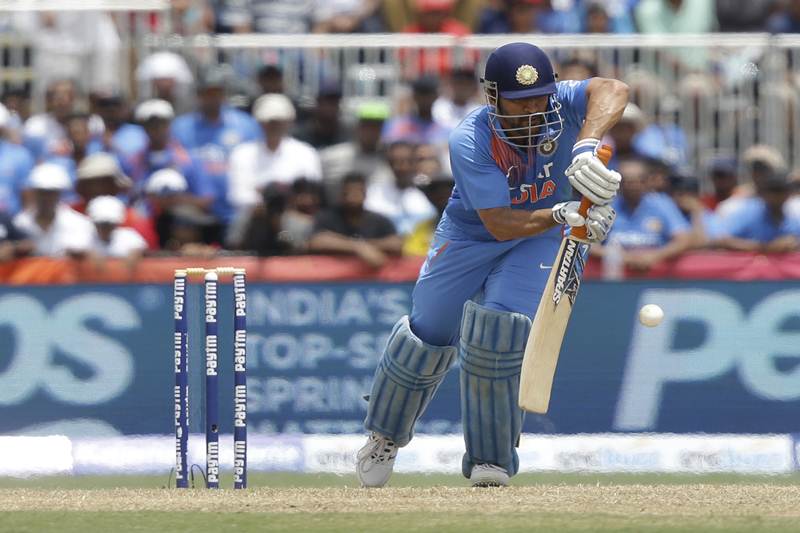 India's MS Dhoni bats during the first Twenty20 international cricket match against the West Indies. India's MS Dhoni had won the toss before the match and had decided to bowl first. However, Johnson Charles and Evin Lewis pulled off a score of 126 runs in the first innings. (AP)