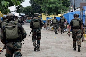 Security personnel patrolling after an attack by NDFB (S) terrorists in the market area at Balajan Tinali near Kokrajhar town in Assam on Friday. (PTI)