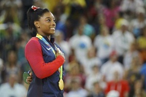 Biles lost her status as Rio de Janeiro's juggernaut after a blunder on the balance beam prevented her from a record-tying fourth gold in gymnastics at these games (Reuters)