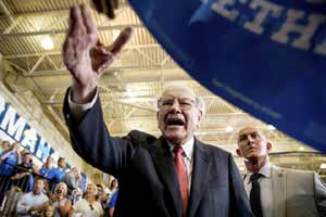 Billionaire investor Warren Buffett has said he'll do whatever it takes to defeat Donald Trump including escorting people to the polls himself. (AP)