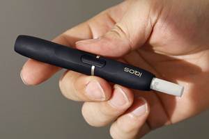 Unlike conventional e-cigarettes that vaporise a nicotine infused liquid, iQOS produces a smokeless aerosol by heating tobacco leaf packed into stubby cigarettes inserted into the device. (Reuters) Unlike conventional e-cigarettes that vaporise a nicotine infused liquid, iQOS produces a smokeless aerosol by heating tobacco leaf packed into stubby cigarettes inserted into the device. (Reuters)