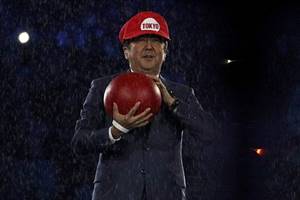 Dressed up as Nintendo game character Super Mario, Abe was handed over the baton to host the 2020 Olympics. (Reuters)