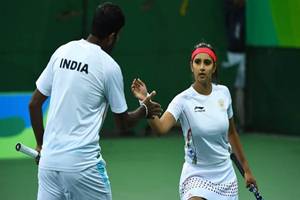 India's sagging fortunes in the Games got a major boost with Sania and Bopanna cruising into the mixed doubles semis in tennis on day seven of competitions while Vikas Kishan punched his way into the boxing quarter-finals. (Source: IE)
