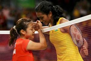 PV Sindhu clasps hands with Nozomi Okuhara of Japan over the net after winning her semifinal match at the Rio Olympics 2016 on Thursday. (Source: Reuters)
