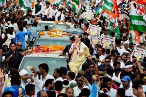 Varanasi: Congress Party President Sonia Gandhi gestures during a road show in the view of upcoming UP Assembly elections in Varanasi on Tuesday. (PTI Photo) Varanasi: Congress Party President Sonia Gandhi gestures during a road show in the view of upcoming UP Assembly elections in Varanasi on Tuesday. (PTI Photo)