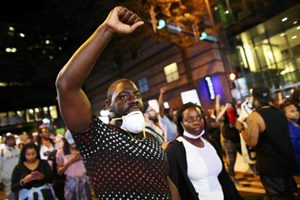 Members of the National Guard carrying rifles were also deployed in front of office buildings to head off another night of violence in this city on edge. (Reuters)