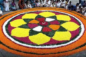 The ritual of making the flower mats continues for all ten days of Onam. Basic design is prepared on the first day and the size of a Pookalam is increased by adding more to it on every passing day, hence a massive Pookalam gets ready for the main day of the occasion. (PTI) The ritual of making the flower mats continues for all ten days of Onam. Basic design is prepared on the first day and the size of a Pookalam is increased by adding more to it on every passing day, hence a massive Pookalam gets ready for the main day of the occasion. (PTI)