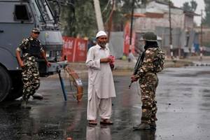 Escorted by heavy convoy of security forces, the scheduled run of the peace bus service between Srinagar and Muzaffarabad was operated carrying members of the divided families between the two parts of divided Kashmir. (Source: Reuters)