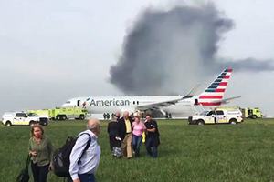 The 161 passengers and nine crew members were evacuated down emergency chutes on the left side of the plane while the wing on the right side burned, Chicago Tribune reported. (AP)