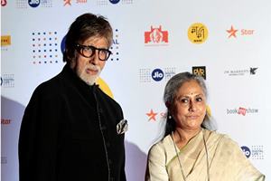 Bollywood actor Amitabh Bachchan with his wife Jaya Bachchan poses for the photographers during the photo call of the opining ceremony of MAMI 18th Mumbai film festival in Mumbai. (AP)