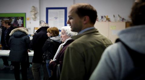 People wait in a line to vote at a polling station in the second round of the French conservatives nationwide primary election in Paris. (AP) People wait in a line to vote at a polling station in the second round of the French conservatives nationwide primary election in Paris. (AP)