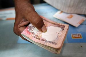 The directive comes against the backdrop of reports that some are using other persons' bank accounts to convert their black money into new denomination notes. (Reuters)