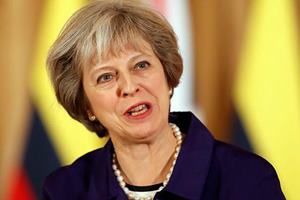 Theresa May has said she wants to invoke Article 50 of the EU's Lisbon Treaty by the end of March, kicking off up to two years of exit negotiations. (AP)