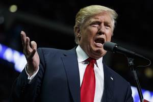 A Rhode Island woman upset over the election of Donald Trump has spent her day giving out free hugs. (AP)