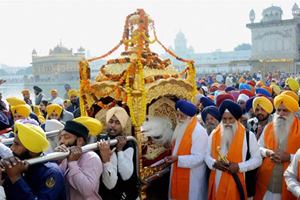 They carry out processions and read out hymns from the holy book of Sikhs, Guru Granth Sahib, which contains 974 of Guru Nanak's teachings. (PTI)