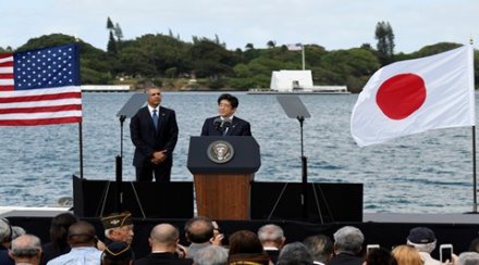 Japanese Prime Minister Shinzo Abe give remarks as U.S. President Barack Obama listens at Kilo Pier overlooking the USS Arizona Memorial at Joint Base Pearl Harbor-Hickam in Honolulu, Hawaii, U.S. December 27, 2016. REUTERS/Hugh Gentry