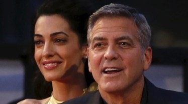 George allegedly plans to move to Britain as he's "growing impatient" at Amal's "taste for the high life" and lavish spending. (Reuters)