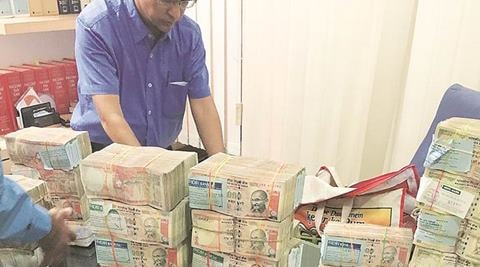 Unaccounted cash worth Rs 4.4 lakh in new currency notes of Rs 2,000 was seized today from Krishna district of Andhra Pradesh, police said. (IE) Unaccounted cash worth Rs 4.4 lakh in new currency notes of Rs 2,000 was seized today from Krishna district of Andhra Pradesh, police said. (IE)