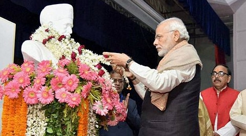 Prime Minister Narendra Modi pays floral tributes to Pandit Madan Mohan Malaviya at Banaras Hindu University. (PTI)