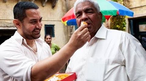 The prime perpetrator behind this cycle, their father and coach Mahavir Singh Phogat, is the central figure in Saurabh Duggal’s Akhada. (Source: IE)