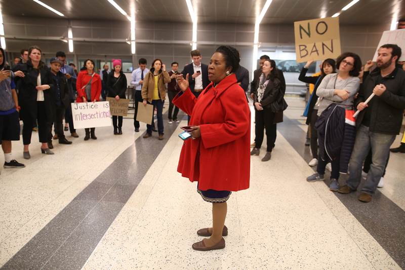 US Representative Sheila Jackson Lee speaks to protesters at George Bush Intercontinental Airport in Houston, Texas. (Reuters)