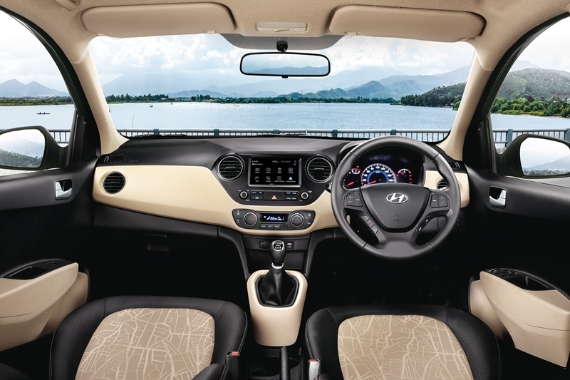 The interior of the new Hyundai Grand i10 has a dual tone colour theme of grey and beige. The layout remains the same as the outgoing version which includes rear AC vents, a cooled glovebox, push button start/stop with smart key and a height adjustable driver's seat.