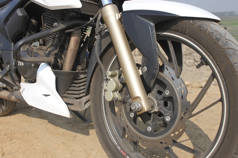 The Bajaj Pulsar NS200 is offered with 280 mm front disc brake and a 230 mm rear disc brake. However, it is not available with ABS (Anti-lock Braking System). The TVS Apache 200 4V, on the other hand, has optional ABS along with Pirelli tyres.