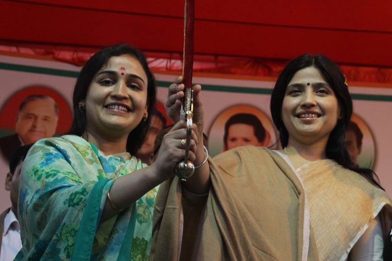 Suggesting all is well in the first family of the Samajwadi Party, Dimple Yadav, wife of Chief Minister Akhilesh Yadav, today campaigned for her sister-in- law Aparna Yadav in Lucknow Cantt Assembly seat.Standing alongside Aparna, a reticent Dimple, who appeared more confident, cited various development works undertaken by the SP government against those of the BJP-led dispensation at the Centre, which she said did nothing but ban notes and force people to stand in queues outside banks and harm interests of small traders and artisans. SP MP and Dimple Yadav and SP candidate Aparna Yadav at an election rally in Lucknow on Wednesday. (PTI)