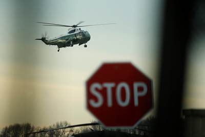 US President Donald Trump arrives aboard the Marine One to greet the remains of a US military commando killed during a raid on the al Qaeda militant group in southern Yemen on Sunday, at Dover Air Force Base. (Reuters)
