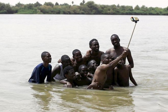 People like taking and sharing selfies, but do not like seeing others posting them on social media. (Reuters)