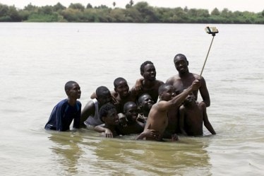 People like taking and sharing selfies, but do not like seeing others posting them on social media. (Reuters)