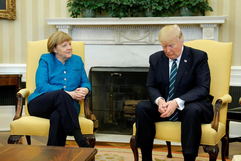viral, viral angela merkel, awkward, angela merkel, angela merkel photos, angela merkel germany, angela merkel handshake, donald trump, donald trump germany, us, united states of america