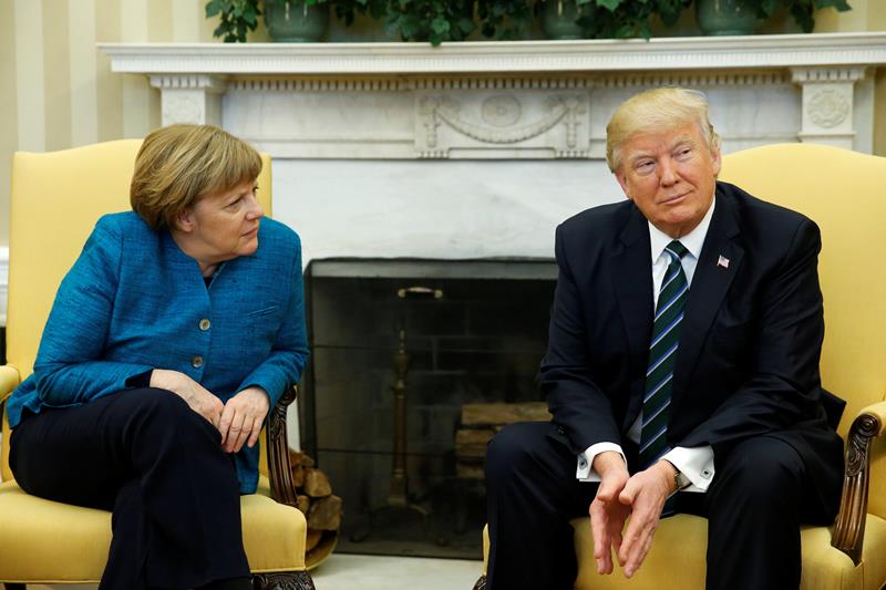 viral, viral angela merkel, awkward, angela merkel, angela merkel photos, angela merkel germany, angela merkel handshake, donald trump, donald trump germany, us, united states of america