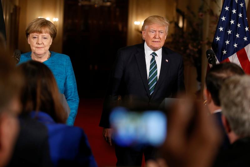 viral, viral angela merkel, awkward, angela merkel, angela merkel photos, angela merkel germany, angela merkel handshake, donald trump, donald trump germany, us, united states of america