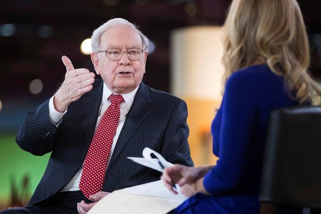 Warren Buffett says he's investing heavily in Apple, believing that once consumers begin using the company's products they aren't likely to stop. (AP)
