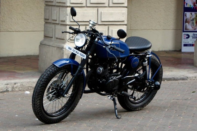 Cafe Racer - Pulsar 150: Bombay Custom Works has put together this classically beautiful looking machine, which is a quite a cross between a bobber and a cafe racer. Although the exhaust has not been changed for one that would look in place on a classic looking motorcycle.