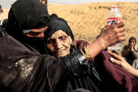 Khatla Ali Abdullah, 90, is embraced as she flees her home as Iraqi forces battle with Islamic State militants in western Mosul, Iraq February 27. (Reuters)