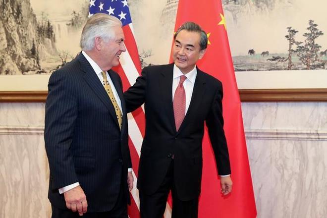 Chinese Foreign Minister Wang Yi and with US Secretary of State Rex Tillerson. (Reuters) Chinese Foreign Minister Wang Yi and with US Secretary of State Rex Tillerson. (Reuters)