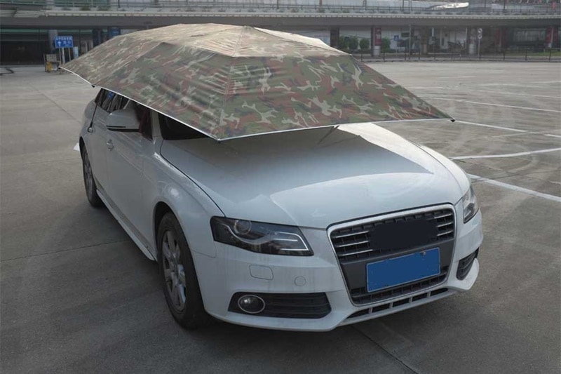 You might find this funny, but no, this isn't a meme. The car umbrella is very much a product, and is actually quite handy if you can not find any shade to park your car under. (Image: Aliexpress)