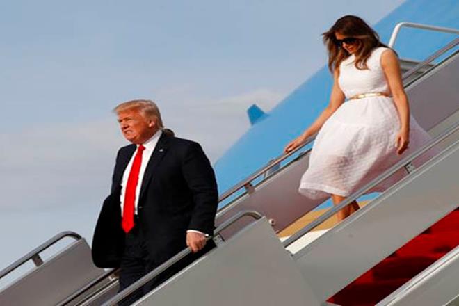 The US leader and a retinue of family and aides, including First Lady Melania Trump and youngest son Barron, 11, arrived at Andrews Air Force Base a little after 2226 GMT. (Associated Press) The US leader and a retinue of family and aides, including First Lady Melania Trump and youngest son Barron, 11, arrived at Andrews Air Force Base a little after 2226 GMT. (Associated Press)