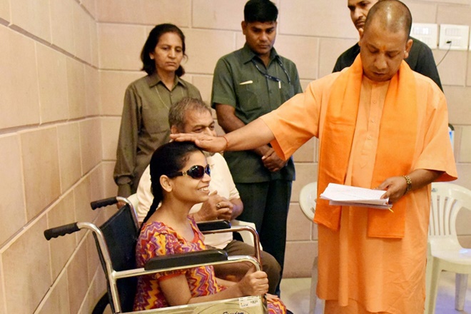 Uttar Pradesh Chief Minister Yogi Adityanath listening to people's problems during his Janata Darbar in Lucknow on Monday. (PTI Photo) Uttar Pradesh Chief Minister Yogi Adityanath listening to people's problems during his Janata Darbar in Lucknow on Monday. (PTI Photo)