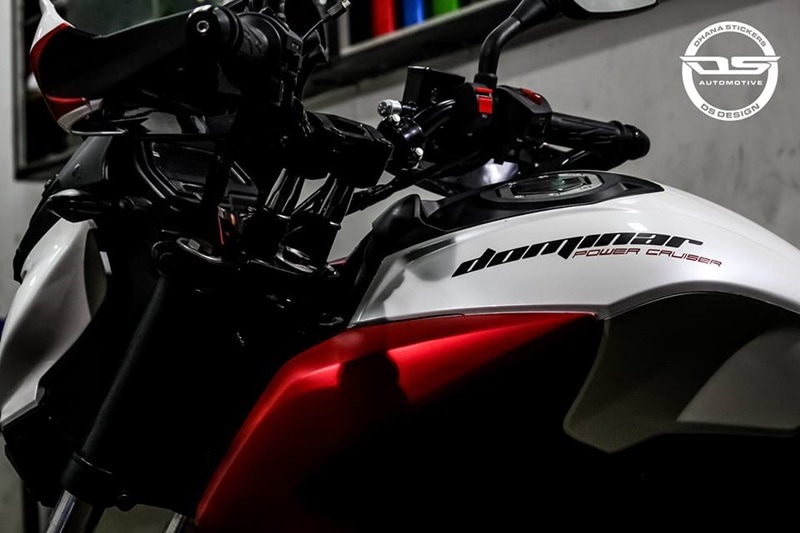 Dhana Stickers have given this Dominar 400 a custom wrap. A bright, but matte finish wrap highlights the motorcycle's bodywork.