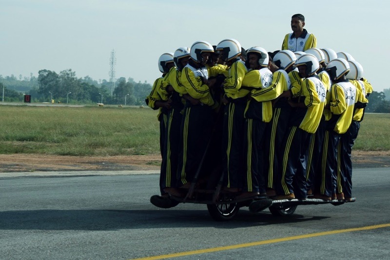 Yes, there is a motorcycle somewhere in the middle of this bunch of Army men. The record for most people on one motorcycle is held by the Indian Army Corps of Signals 'Daredevils' Display Team - 56 men. The motorcycle used for this feat deserves a mention too. It was a Royal Enfield Bullet 500, which is a much beloved bike for many Indians.