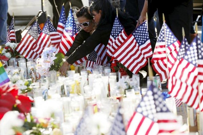 People leave flowers at a makeshift memorial after shooting in San Bernardino, California December 7, 2015. (Reuters) People leave flowers at a makeshift memorial after shooting in San Bernardino, California December 7, 2015. (Reuters)