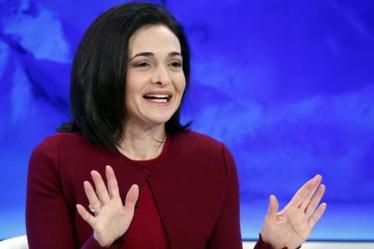 The Facebook Inc. chief operating officer said companies can't resolve social issues on their own and that the government needs to step in. (Reuters)